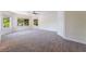 Spacious bedroom with large windows offering lots of natural light, plush carpet, and neutral walls at 11237 Campsie Fells Ct, Las Vegas, NV 89141