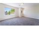 Bedroom with two windows offering lots of natural light, plush carpet, and neutral walls at 11237 Campsie Fells Ct, Las Vegas, NV 89141