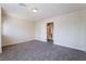 Bedroom with a neutral color scheme, plush carpet, and a door that leads to the bathroom at 11237 Campsie Fells Ct, Las Vegas, NV 89141