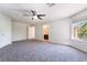 Spacious bedroom featuring plush carpet, light neutral walls, and two entry doors with great natural light at 11237 Campsie Fells Ct, Las Vegas, NV 89141