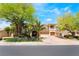 Stunning two-story home boasting desert landscaping, mature trees, and a three-car garage at 11237 Campsie Fells Ct, Las Vegas, NV 89141
