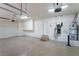 A spacious garage featuring an insulated door, water heater, and ample room for storage at 11237 Campsie Fells Ct, Las Vegas, NV 89141