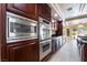 Gourmet kitchen boasts stainless steel appliances and custom cabinetry at 11237 Campsie Fells Ct, Las Vegas, NV 89141