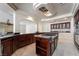Large kitchen with granite countertops and spacious center island with cooktop at 11237 Campsie Fells Ct, Las Vegas, NV 89141