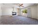 Living room features a fireplace, large windows and ceiling fan at 11237 Campsie Fells Ct, Las Vegas, NV 89141