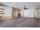 Bright living room with a modern fireplace and built-in shelving at 11237 Campsie Fells Ct, Las Vegas, NV 89141