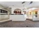 View of the kitchen and dining area from the carpeted living room at 11237 Campsie Fells Ct, Las Vegas, NV 89141