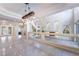 Bright, open living room features tile floors, high ceilings and lots of natural light at 11237 Campsie Fells Ct, Las Vegas, NV 89141