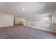 Bright loft area with neutral carpet and open railing at 11237 Campsie Fells Ct, Las Vegas, NV 89141