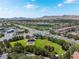 Aerial view of neighborhood park with playground, walking paths, and mature trees at 11237 Campsie Fells Ct, Las Vegas, NV 89141