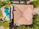 Aerial view of home showing the roof and backyard featuring a custom pool and mature landscaping at 11237 Campsie Fells Ct, Las Vegas, NV 89141