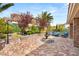 Beautiful backyard showcasing a water fountain, manicured landscaping, and outdoor seating at 11578 Suburban Rd, Las Vegas, NV 89135