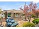 Backyard patio with brick flooring, outdoor seating, water feature, and well-maintained landscaping at 11578 Suburban Rd, Las Vegas, NV 89135