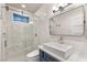 Contemporary bathroom with a sleek glass shower and modern vanity with a vessel sink, blending style and functionality at 11578 Suburban Rd, Las Vegas, NV 89135