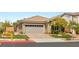 Charming single-story home with a well-maintained lawn and attached two-car garage at 11578 Suburban Rd, Las Vegas, NV 89135