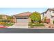 Inviting single-Gathering home with a manicured lawn, mature landscaping, and a spacious two-car garage at 11578 Suburban Rd, Las Vegas, NV 89135