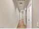 Hallway with wood floors and white trim, connecting various rooms of the house at 11578 Suburban Rd, Las Vegas, NV 89135