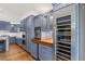 Modern kitchen features custom blue cabinets, stainless steel appliances, and a wood-paneled ceiling at 11578 Suburban Rd, Las Vegas, NV 89135