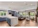 Open-concept living area featuring a gourmet kitchen and cozy seating area at 11578 Suburban Rd, Las Vegas, NV 89135