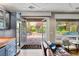 Living room with french doors opening to the patio and a view to the outdoor space at 11578 Suburban Rd, Las Vegas, NV 89135