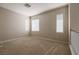 This carpeted bedroom offers neutral walls and bright natural light from multiple windows at 11900 Calle De Sol Dr, Las Vegas, NV 89138