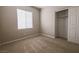 Carpeted bedroom offers natural light and a closet for storage at 11900 Calle De Sol Dr, Las Vegas, NV 89138
