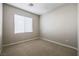 Carpeted bedroom with natural light from a window at 11900 Calle De Sol Dr, Las Vegas, NV 89138