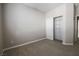 Carpeted bedroom featuring a closet with shelving and natural light at 11900 Calle De Sol Dr, Las Vegas, NV 89138