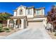 Charming two-story home with a terracotta roof, two-car garage, and covered front porch at 11900 Calle De Sol Dr, Las Vegas, NV 89138