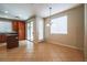 Dining area features tile floors, a chandelier, and access to the kitchen and backyard at 11900 Calle De Sol Dr, Las Vegas, NV 89138