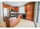 Kitchen with granite countertops, stainless steel appliances, and tile floors at 11900 Calle De Sol Dr, Las Vegas, NV 89138