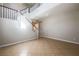 Bright, open living room with staircase, multiple windows, and tile flooring at 11900 Calle De Sol Dr, Las Vegas, NV 89138