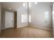 Bright, open living room with high ceilings, multiple windows, and tile flooring at 11900 Calle De Sol Dr, Las Vegas, NV 89138