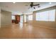Open-concept living space featuring tile floors, a ceiling fan, and a sliding glass door at 11900 Calle De Sol Dr, Las Vegas, NV 89138