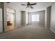 Bright, spacious bedroom with ceiling fan and view of ensuite bathroom at 11900 Calle De Sol Dr, Las Vegas, NV 89138