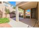 A cozy backyard patio area with easy access to landscaped yard at 11900 Calle De Sol Dr, Las Vegas, NV 89138