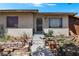 A quaint home exterior with a secure front door and unique landscaping at 121 N 20Th St, Las Vegas, NV 89101