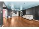 Spacious living room with hardwood floors, a white couch, and an adjoining kitchen, perfect for entertaining at 121 N 20Th St, Las Vegas, NV 89101