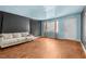 Living room with tan sofa, hardwood floors, and a window at 121 N 20Th St, Las Vegas, NV 89101