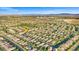 Expansive aerial view of a meticulously planned residential community, set against a backdrop of mountains and clear skies at 12219 Crystal Shore Ave, Las Vegas, NV 89138