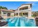 Luxurious backyard with a pool, hot tub, and lounge area, perfect for relaxation at 12219 Crystal Shore Ave, Las Vegas, NV 89138