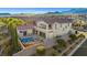 Inviting backyard featuring a pool, spa, covered patio, and lush landscaping perfect for relaxation and entertaining at 12219 Crystal Shore Ave, Las Vegas, NV 89138