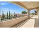 Inviting balcony with views of the surrounding neighborhood and mountains on a clear day at 12219 Crystal Shore Ave, Las Vegas, NV 89138