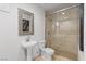 Powder room featuring a pedestal sink and glass shower at 12219 Crystal Shore Ave, Las Vegas, NV 89138