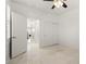 Bright bedroom features tile flooring, ceiling fan, and sliding closet doors at 12219 Crystal Shore Ave, Las Vegas, NV 89138