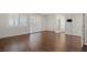A bright bedroom featuring wood floors, plantation shutters, and ample natural light at 12219 Crystal Shore Ave, Las Vegas, NV 89138