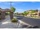 Charming community entrance with stone pillars and lush landscaping creating a welcoming atmosphere at 12219 Crystal Shore Ave, Las Vegas, NV 89138