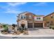 Stunning two-story home with a stone facade, three-car garage, and beautifully landscaped front yard in a desirable location at 12219 Crystal Shore Ave, Las Vegas, NV 89138
