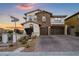 Charming two-story home with stone accents, a tile roof, and a two-car garage at 12219 Crystal Shore Ave, Las Vegas, NV 89138