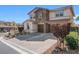 Attractive two-story home featuring a brick driveway and well-manicured landscaping at 12219 Crystal Shore Ave, Las Vegas, NV 89138